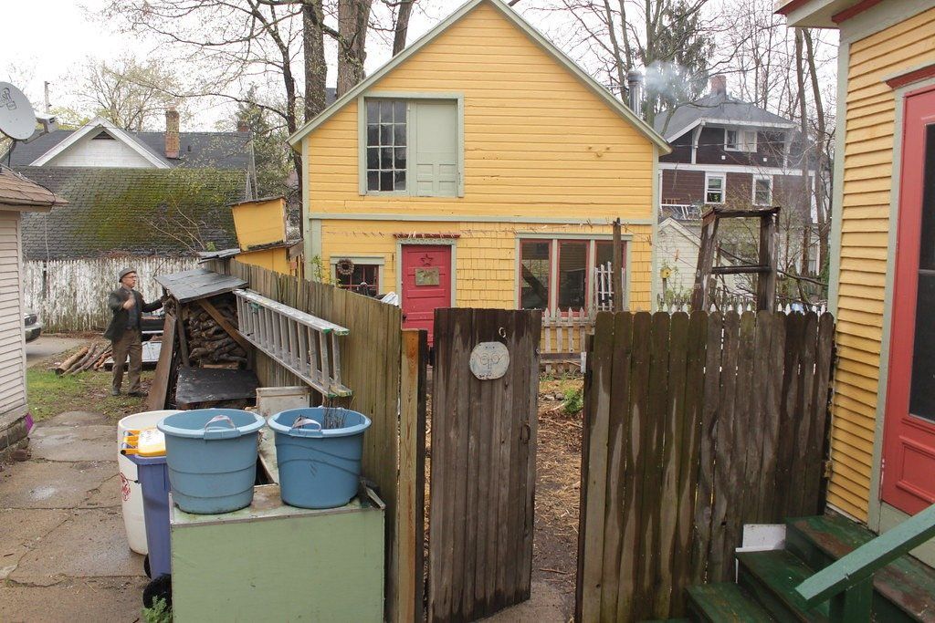 Carriage house studio behind a garden gate